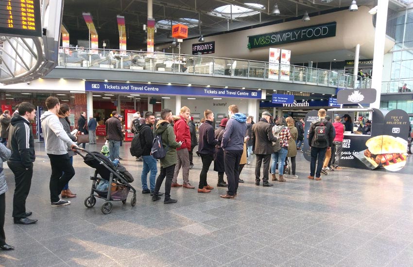 iMP created a pop-up sampling pod at Manchester Piccadilly strain station Experiential train station sampling at Manchester Piccadilly station