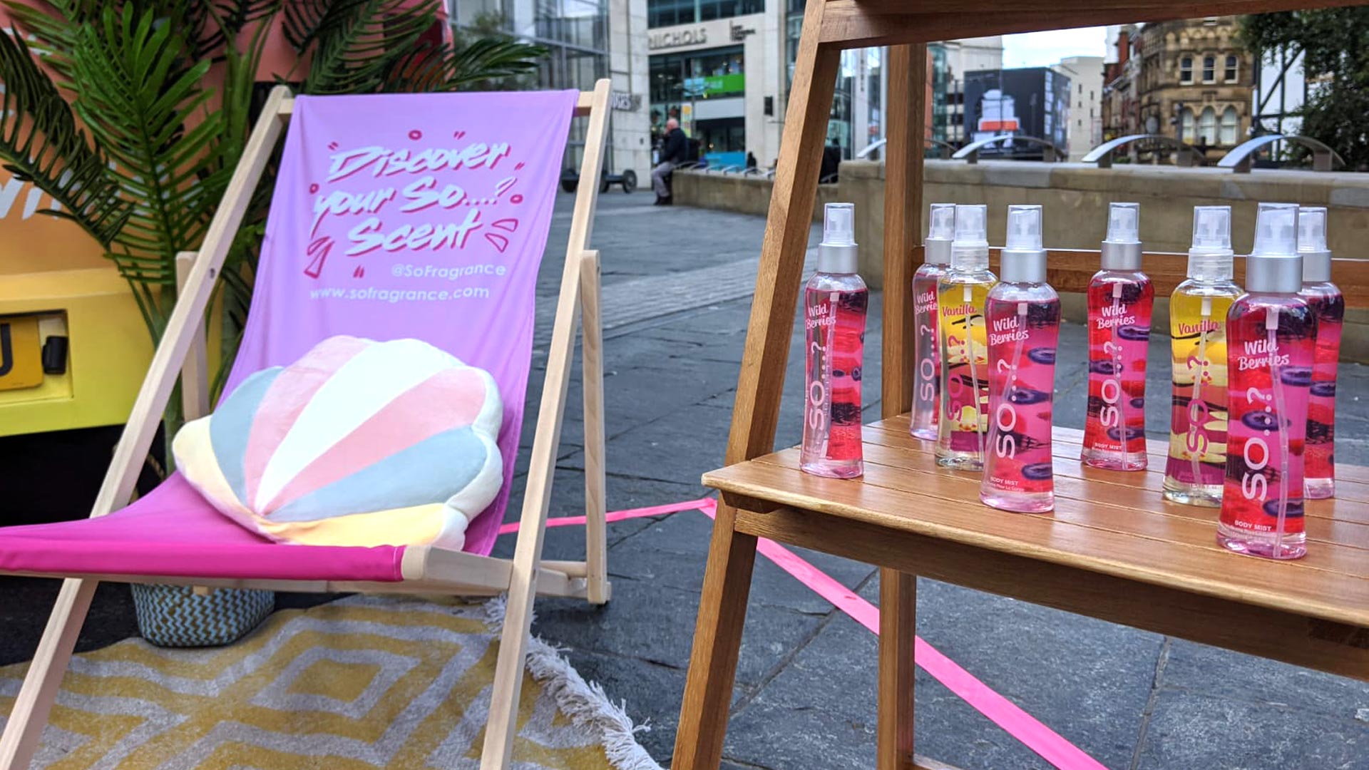 Consumer scanning a retail discount QR code at a mobile beauty sampling event to drive direct-to-consumer online sales