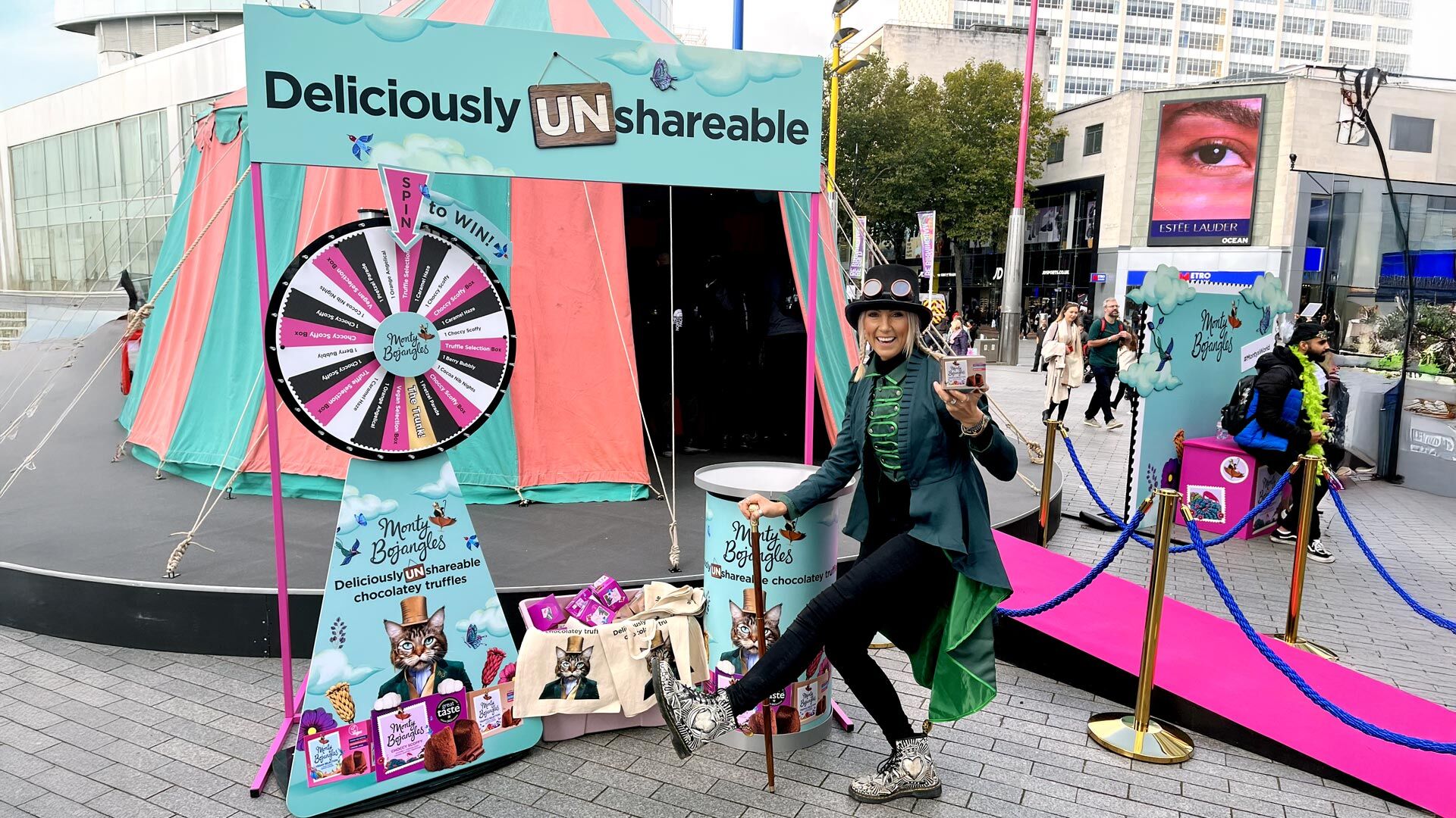 Brand ambassador posing in front of the Monty Bojangles sampling tent.