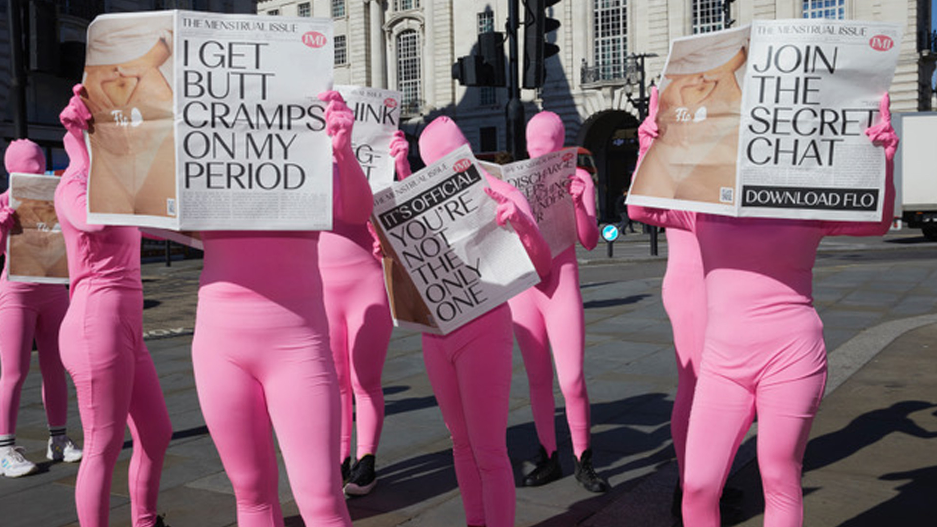 iMP PR stunt staff dressed in pink morph suits for Flo App