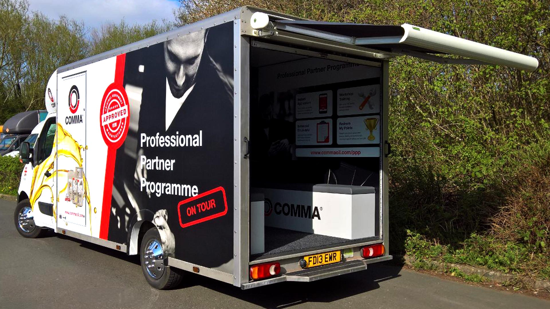 Exhibition vehicle with awning for mobile experiential, trade shows and events