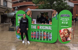 Branded promotional sampling pod generating direct consumer engagement near retail stockists