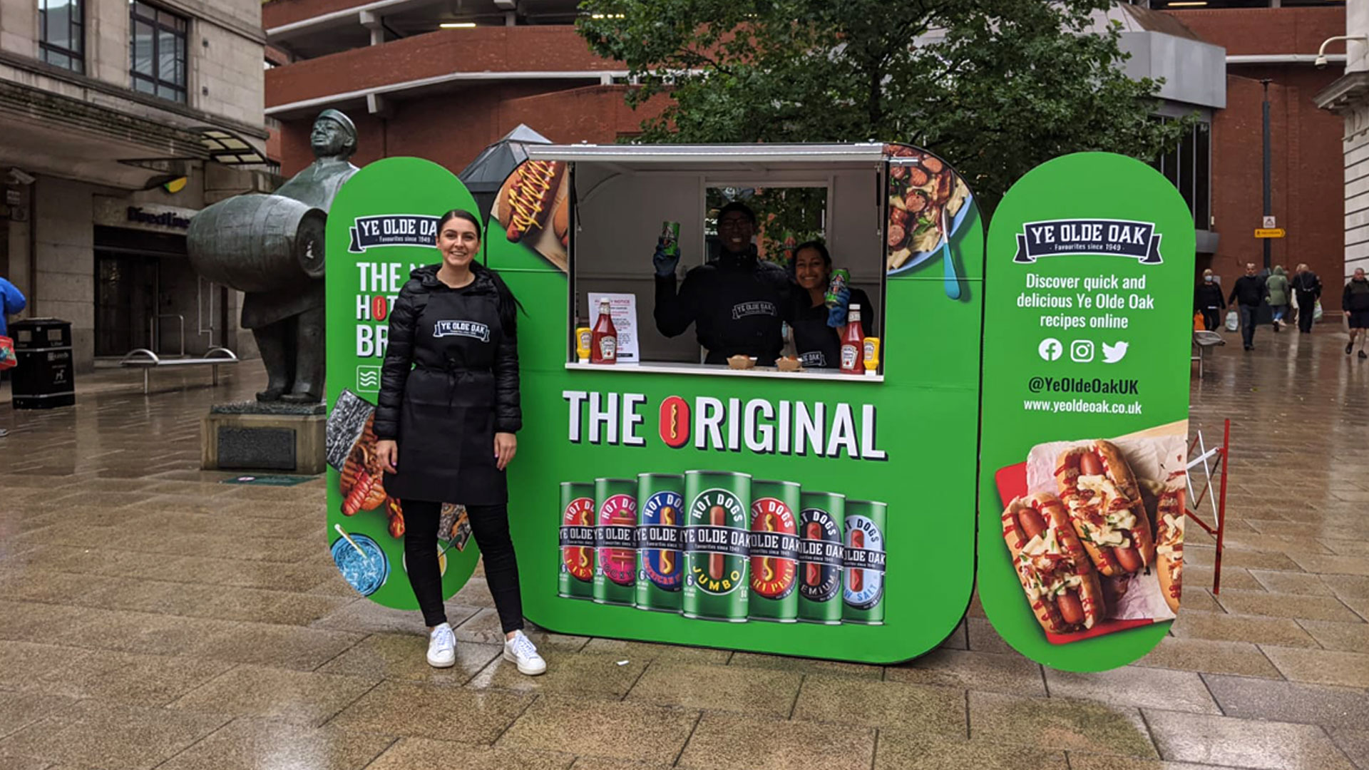 Branded promotional sampling pod generating direct consumer engagement near retail stockists